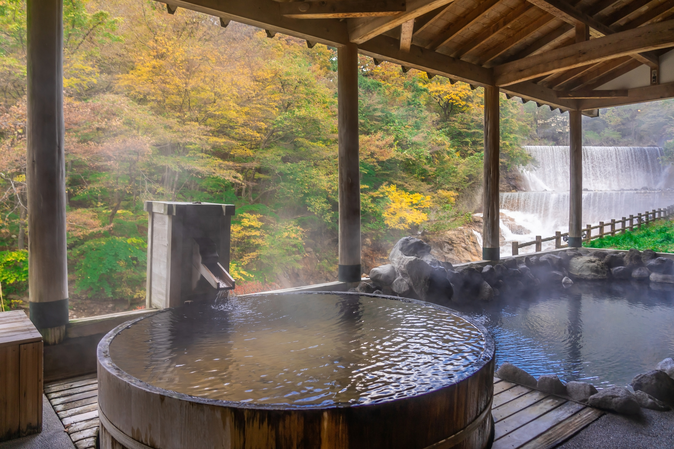 Japanese Hot Springs Onsen Surrounded by Red-Yellow Leaves